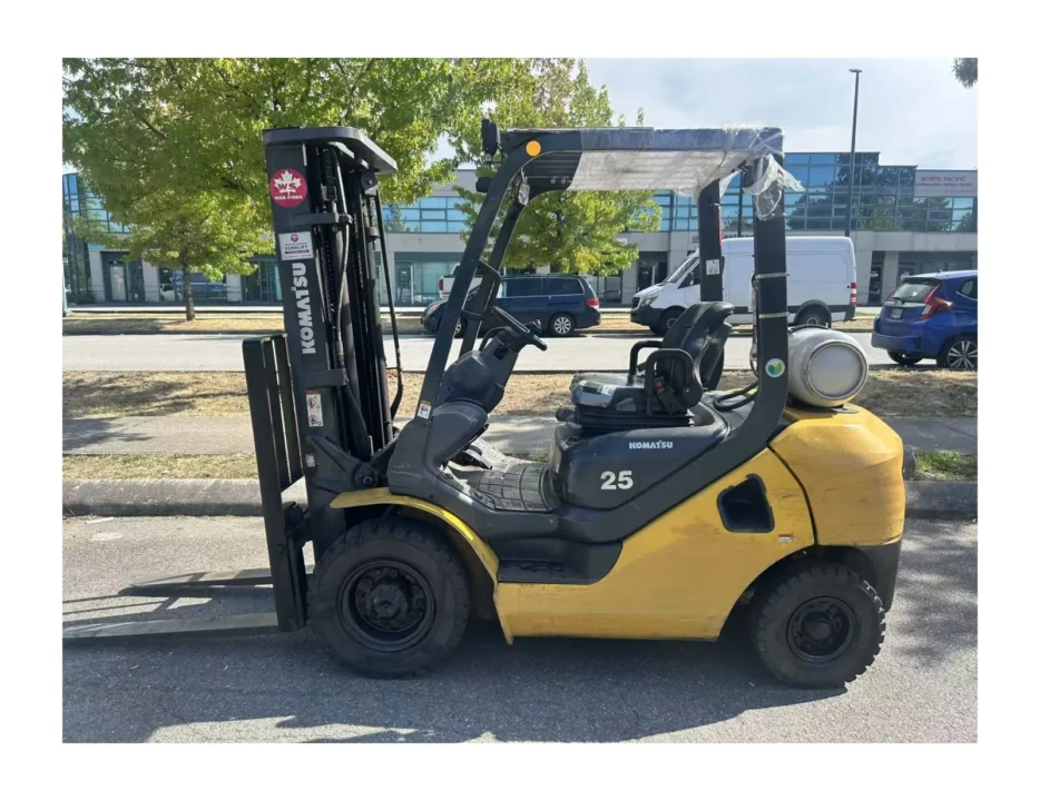 Used Komatsu LPG forklift with triplex mast and solid tires – left side view